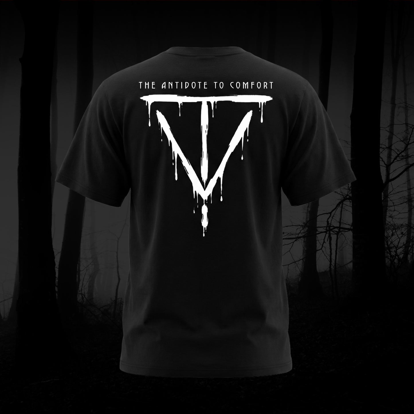 Antidote To Comfort on the back of a black tee shirt