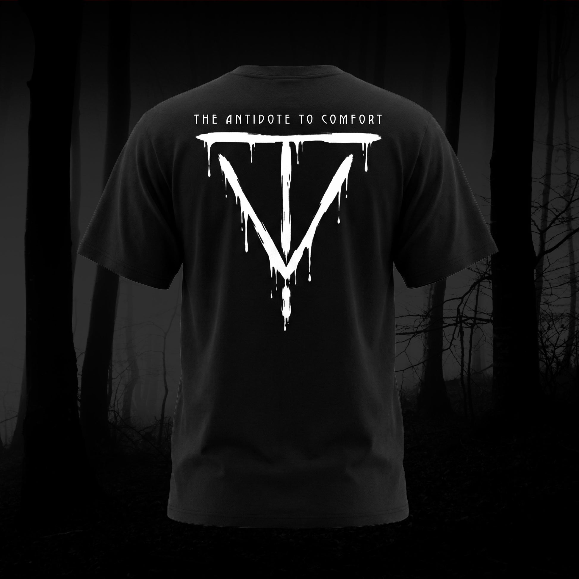 Antidote To Comfort on the back of a black tee shirt